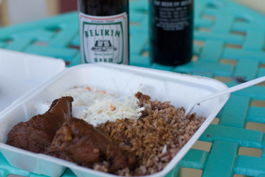 Chicken and rice with coleslaw and Belikin Beer in Belize