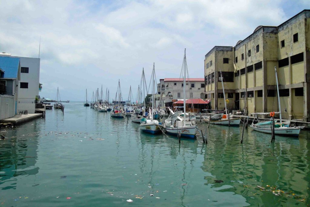 Belize City waterfront with boats in the water