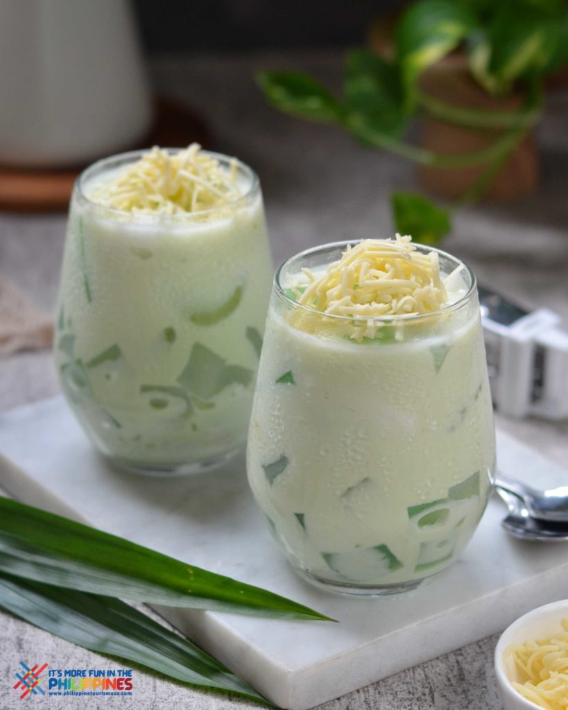 Buko Pandan in two glasses on a marble cutting board