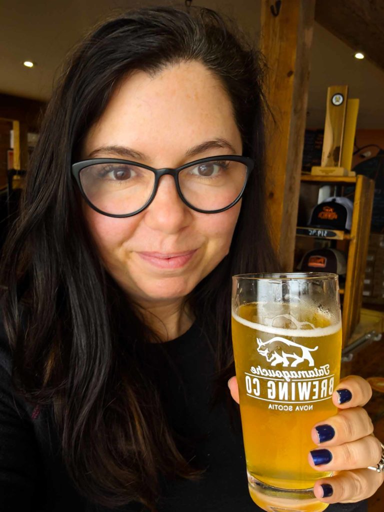 Ayngelina holding beer from Tatamagouche Brewing