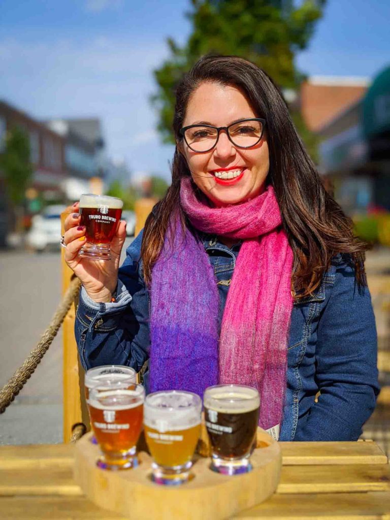 Ayngelina drinking flight of beer at Truro Craft Brewing