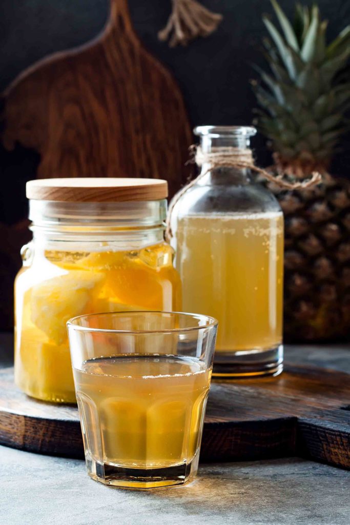 Chicha de pina Ecuadorian drink made with simmered pineapple rinds, panela or sugar and spices