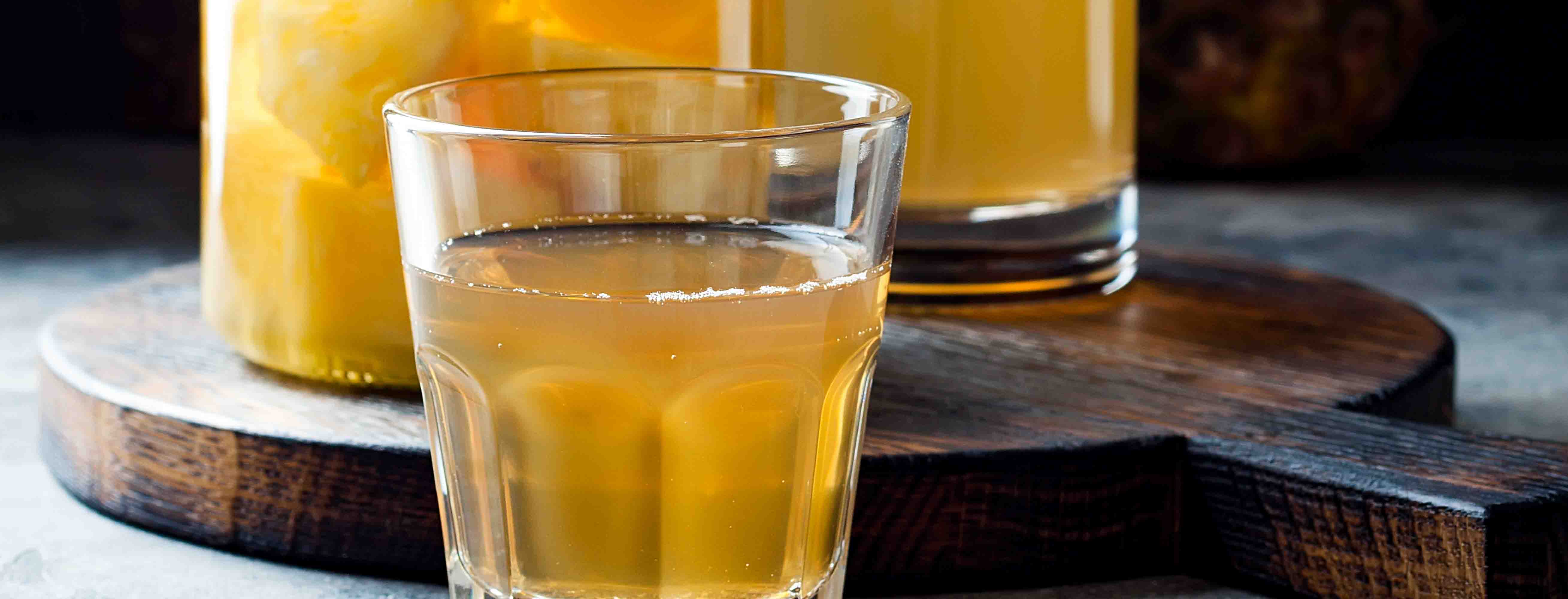 Chicha de pina Ecuadorian drink made with simmered pineapple rinds, panela or sugar and spices