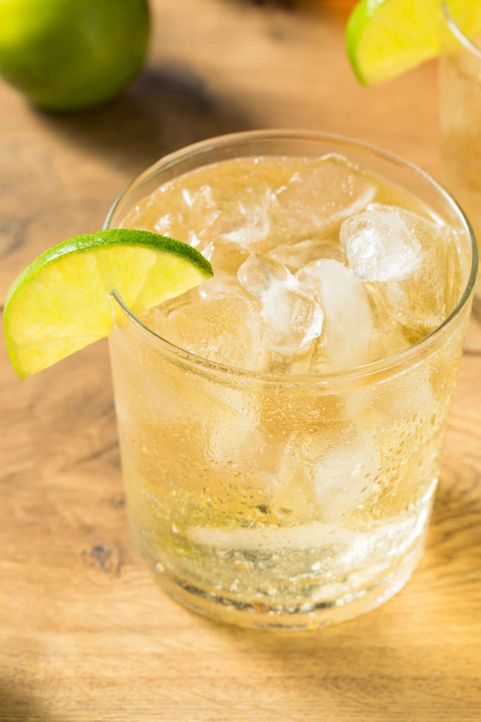 Guatemala Limonada con Soda in a glass with ice on a wooden table