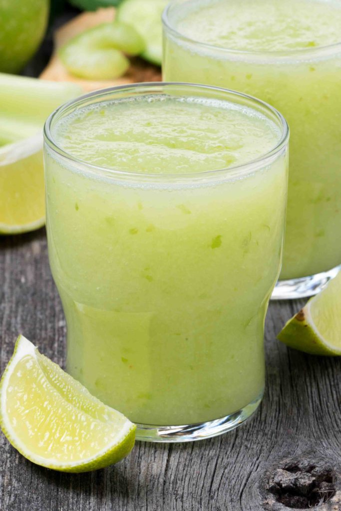 Non alcoholic smoothie in Guatemala on a wooden board with slices of lime