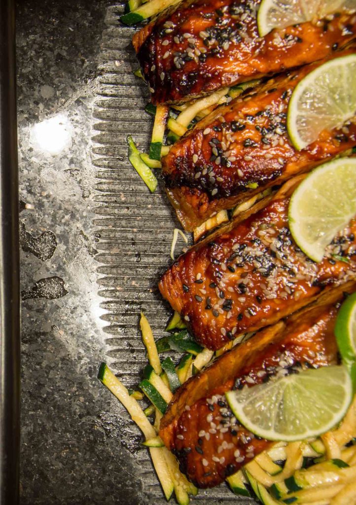 Salmon in Iceland, fillets on a tray with lemon and zucchini