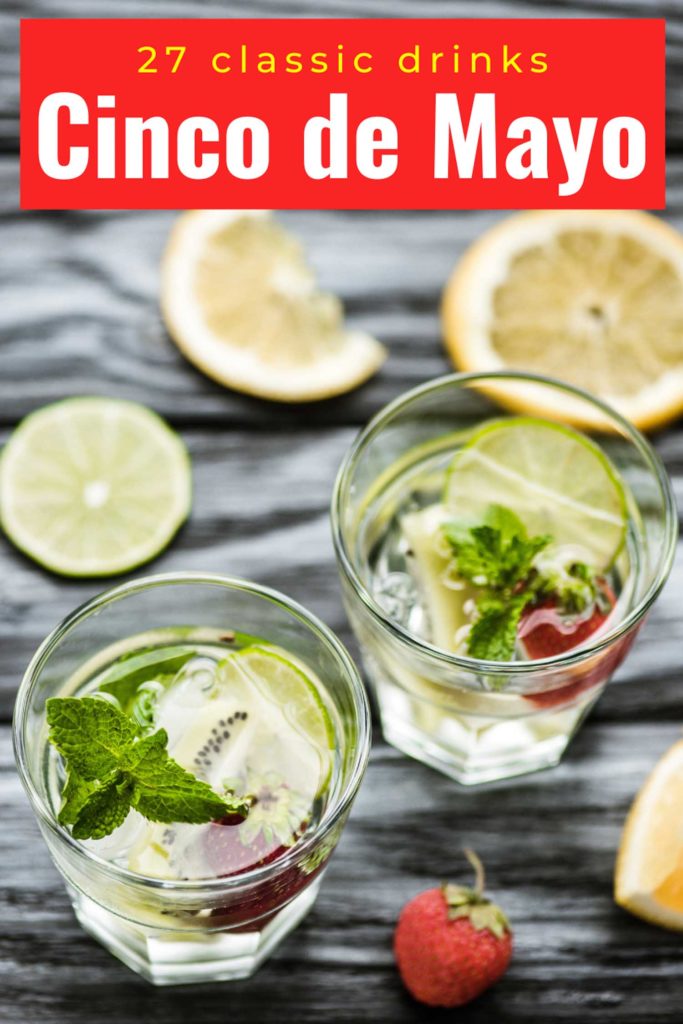 Two cocktails garnishes with citrus and mint on a grey cloth with text 27 Cinco de Mayo drinks