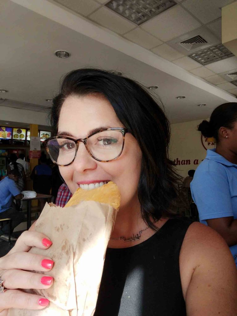 Ayngelina eating Jamaican patty in Montego Bay