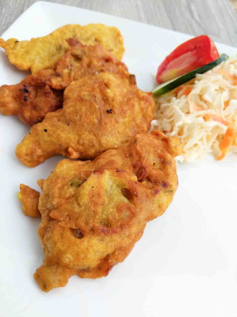 Stamp and go saltfish fritters on a white plate