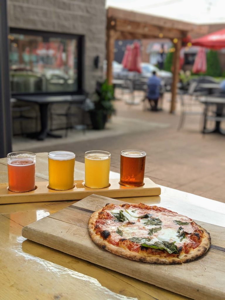 King West Brewing Rustico, pizza and flight of beer