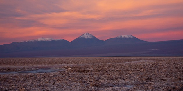 Tierra Atacama salt flats with Andes mountains in background at sunset