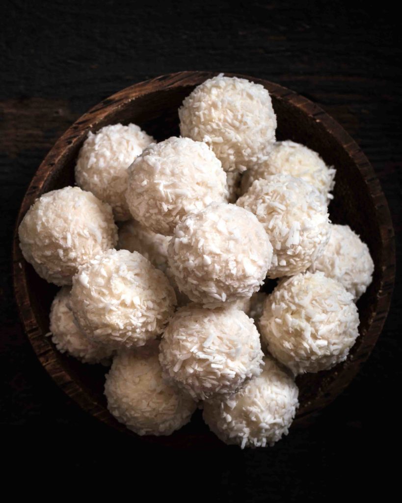 Costa Rican coconut balls in wooden bowl