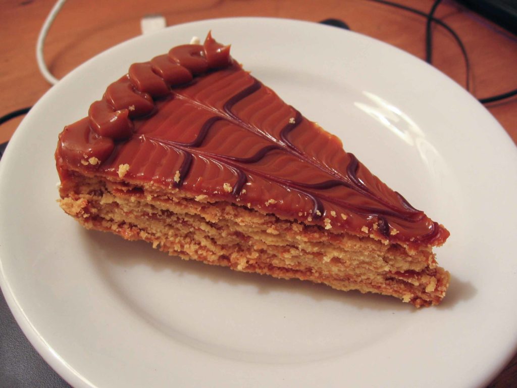 Torta Chilena a common dessert in Costa Rica, on a white plate