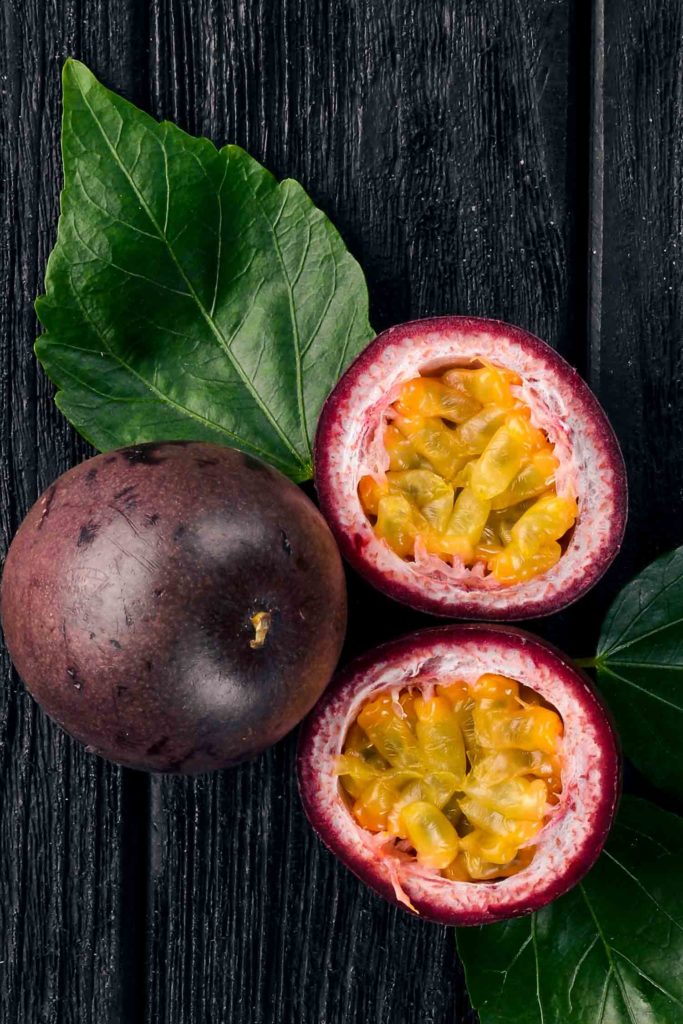 Colombia fruit Gulupa Passionfruit. Tropical Fruits. On a wooden background. Top view.