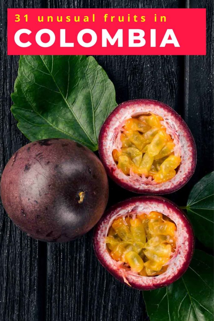 Fruits in Colombia Gulupa Passionfruit. Tropical Fruits. On a wooden background. Top view.