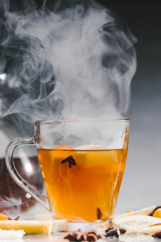 Hot coca tea in a clear mug