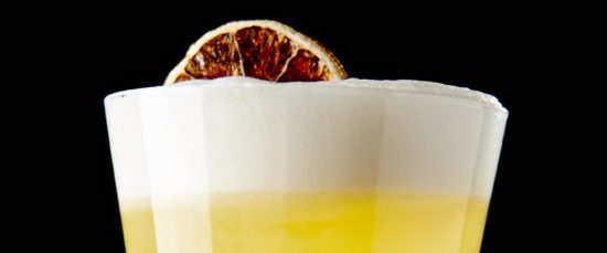 Pisco Sour Egg White and Angostura Bitters on Black