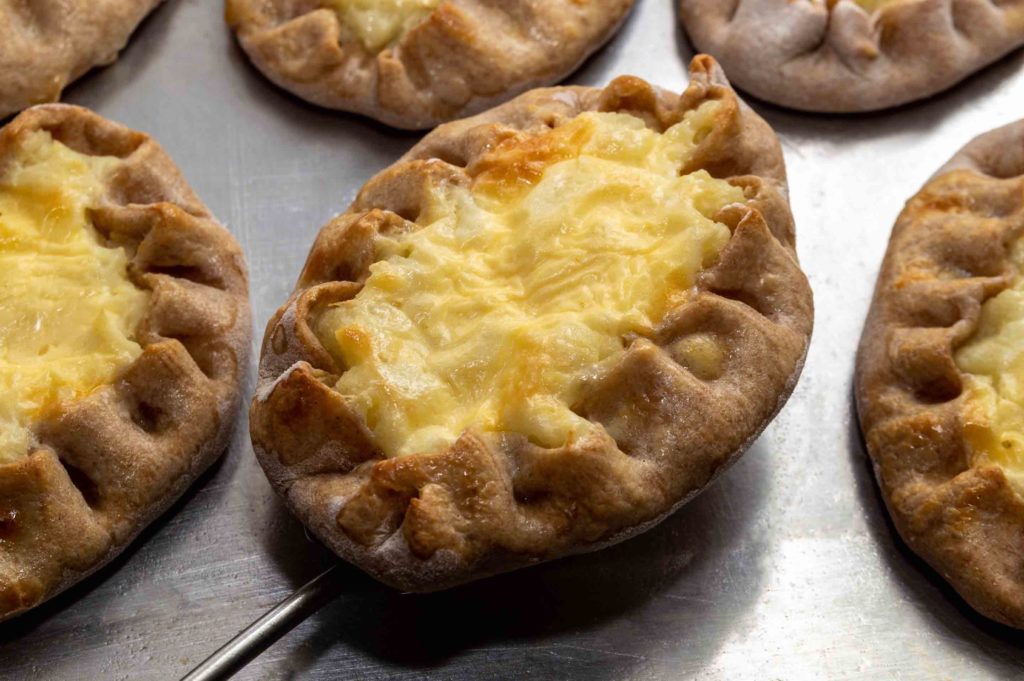 traditional Karelian open pies made of rye dough and potato fillings. wickets. High qyality photo