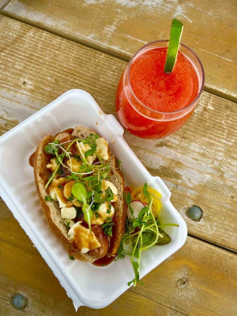 Poutine Hot Dog and Strawberry Slush at Euston Social at Parlee Beach Provincial Park in Shediac New Brunswick