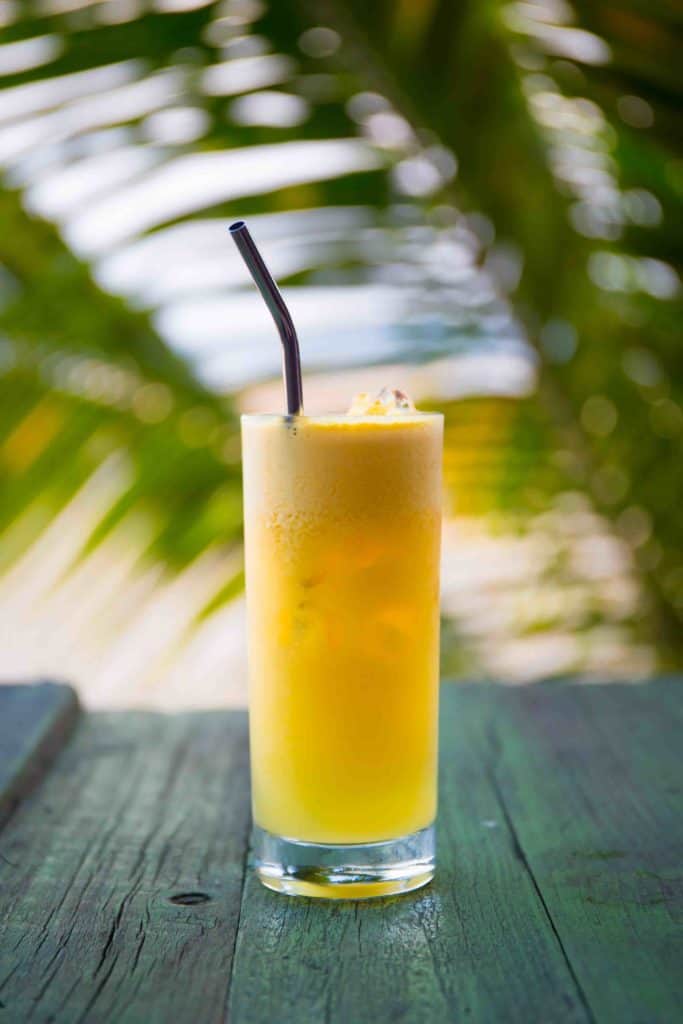 Drinks in Brazil Cupuaçu Juice on a table in looking onto the ocean