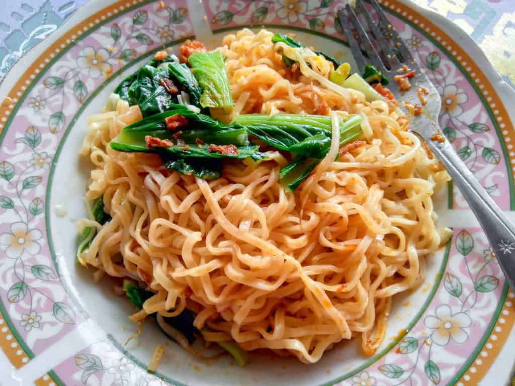 mie goreng, vegetarian Indonesian food with noodles, on a vintage plate