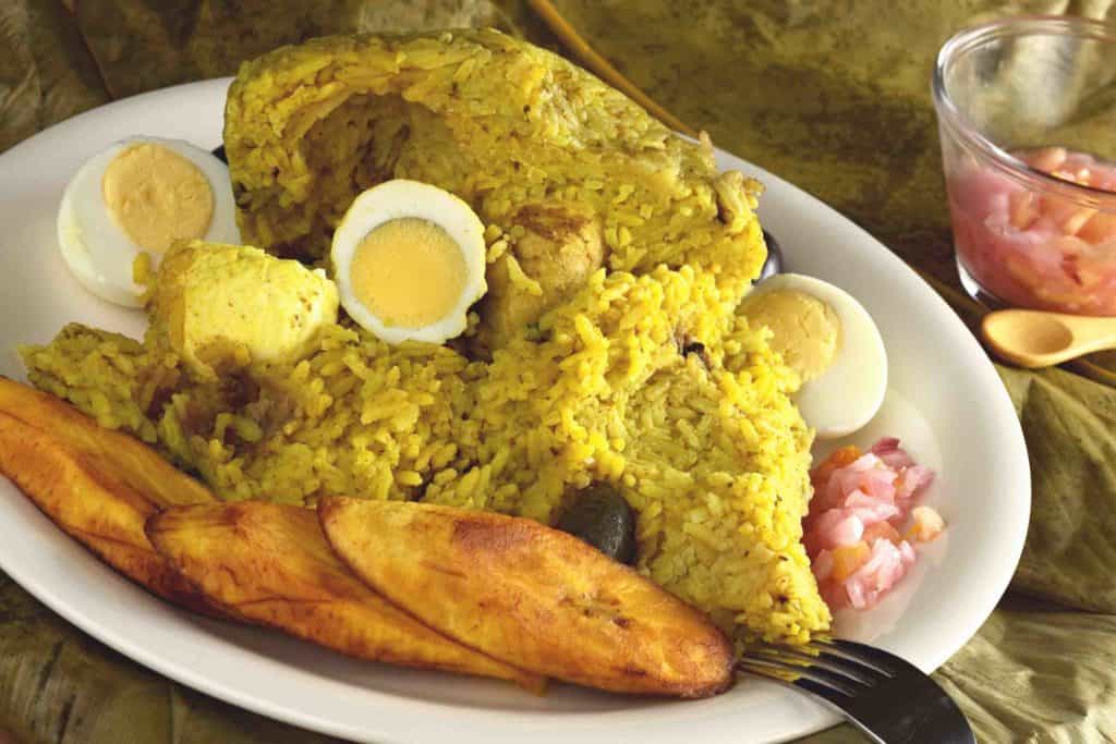 Traditional Peruvian Snack Food Called Juane on a plate with banana and boiled egg
