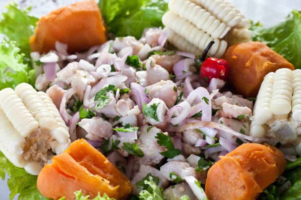 Peruvian snack ceviche with camote and corn