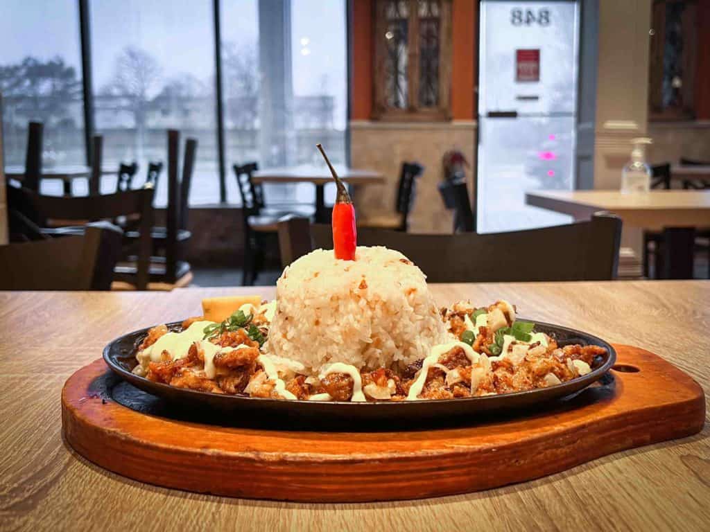 Pork Sigsig on a table at Bella's Inasal in Mississauga