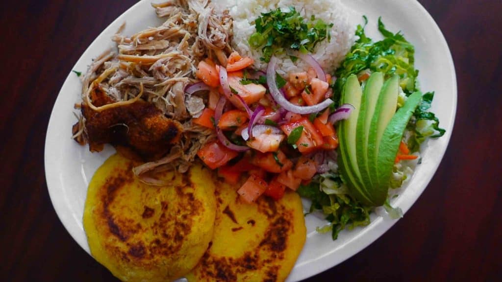 Ecuadorian hornado on the table at La Bonita Latin American restaurant in Mississauga