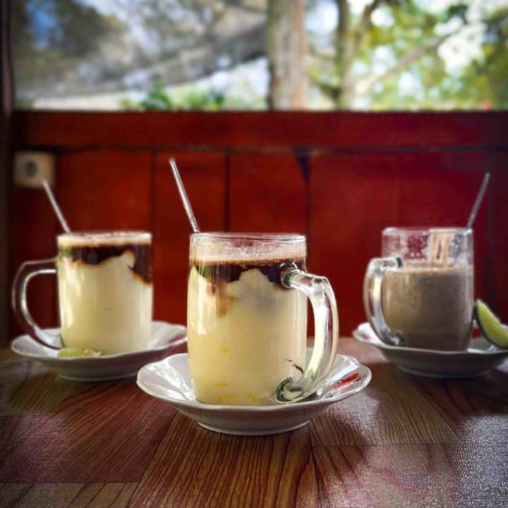 Teh talua or teh talur Indonesian egg tea in 3 varieties on a table