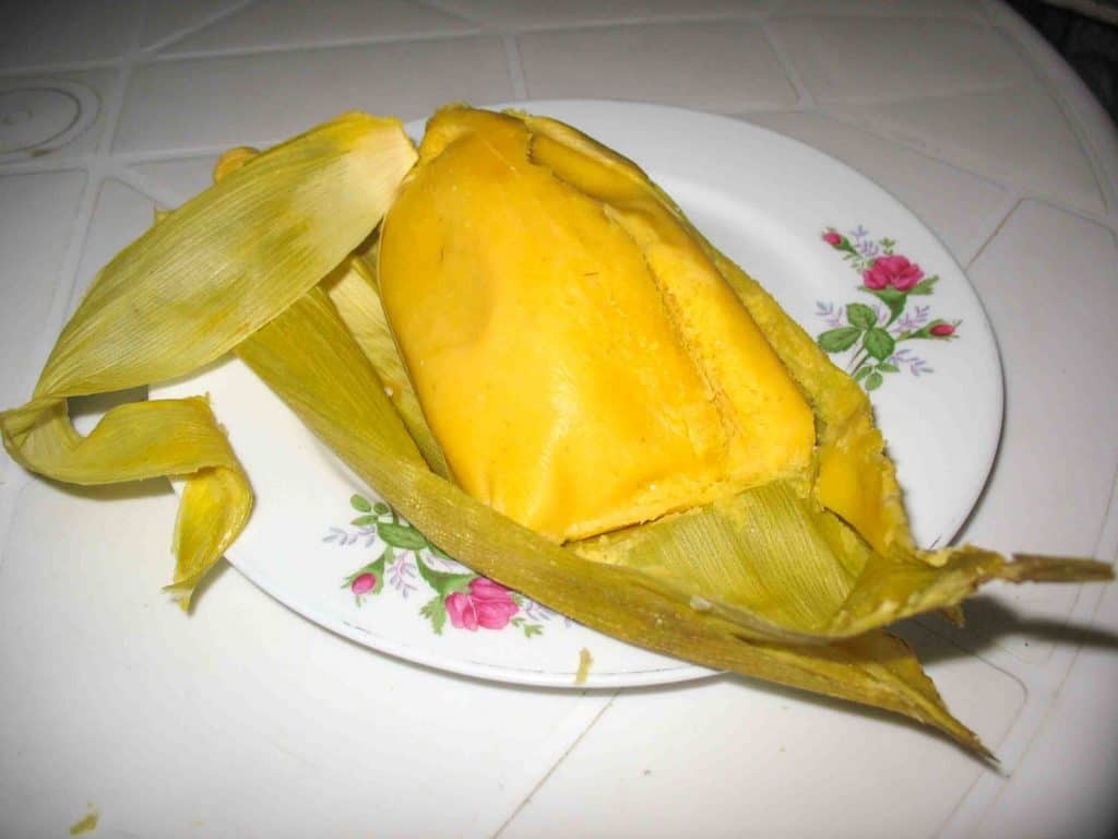 bollo de mazorca traditional colombian breakfast on white plate