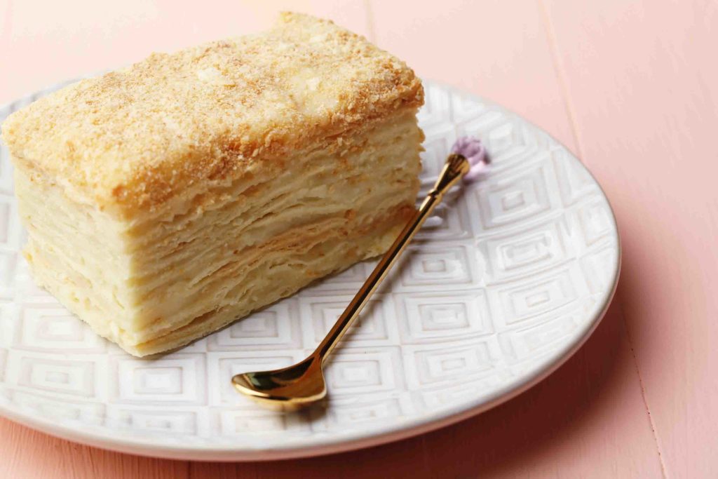 Colombian milhojas Napoleon cake on plate on table close-up