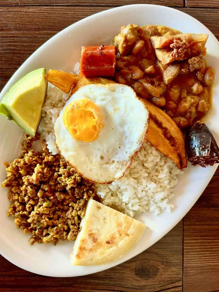 Bandeja paisa breakfast in Colombia on table