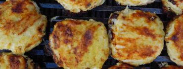 Street food in Colombia: Arepas rellenas on the grill in Santa Marta