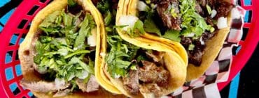 Authentic mexican tacos in plastic basket in restaurant in Mississauga