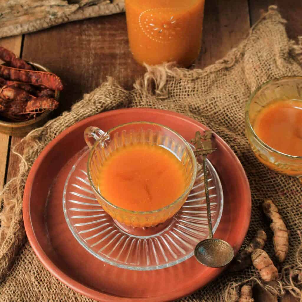 Jamu Kunyit Asam, Traditional Indonesian Herbal Tonic Drink. Made from Turmeric, Tamarind, and Palm Sugar. Usually Served To Boost Imune