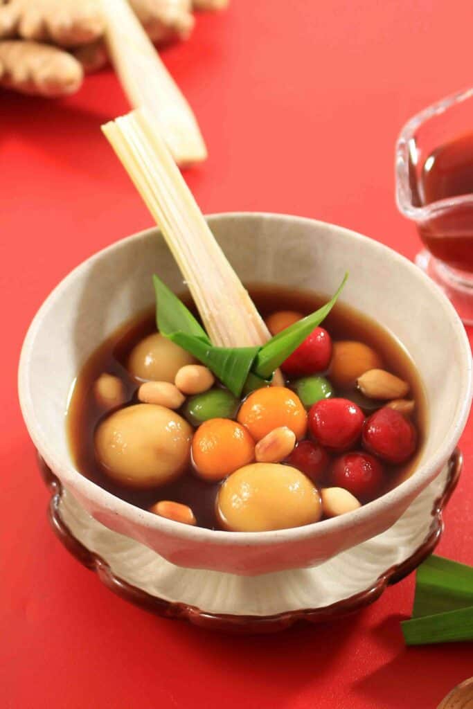 Wedang Ronde, Chewy Round Cake Filled with Caramelized Peanuts with Warm Ginger Drink or Palm Sugar Syrup from Central Java.