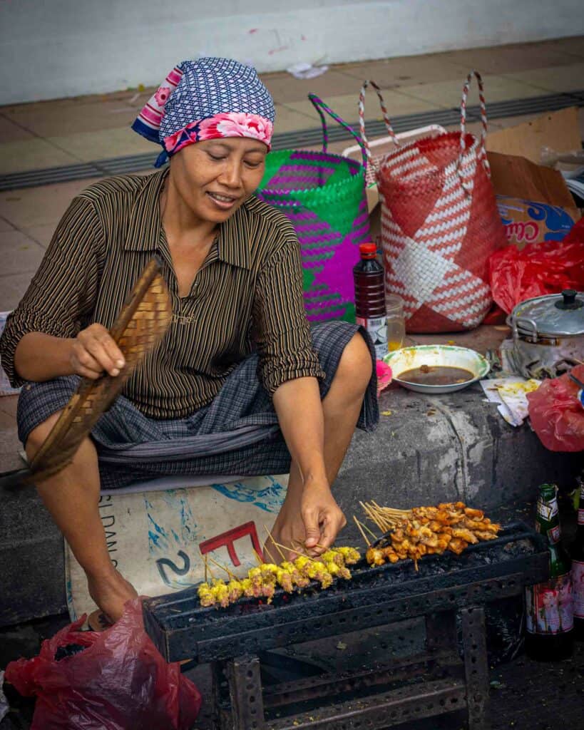woman cooking sate in surabaya