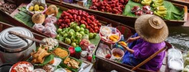 Thai fruit in a boat on the river with a vendor