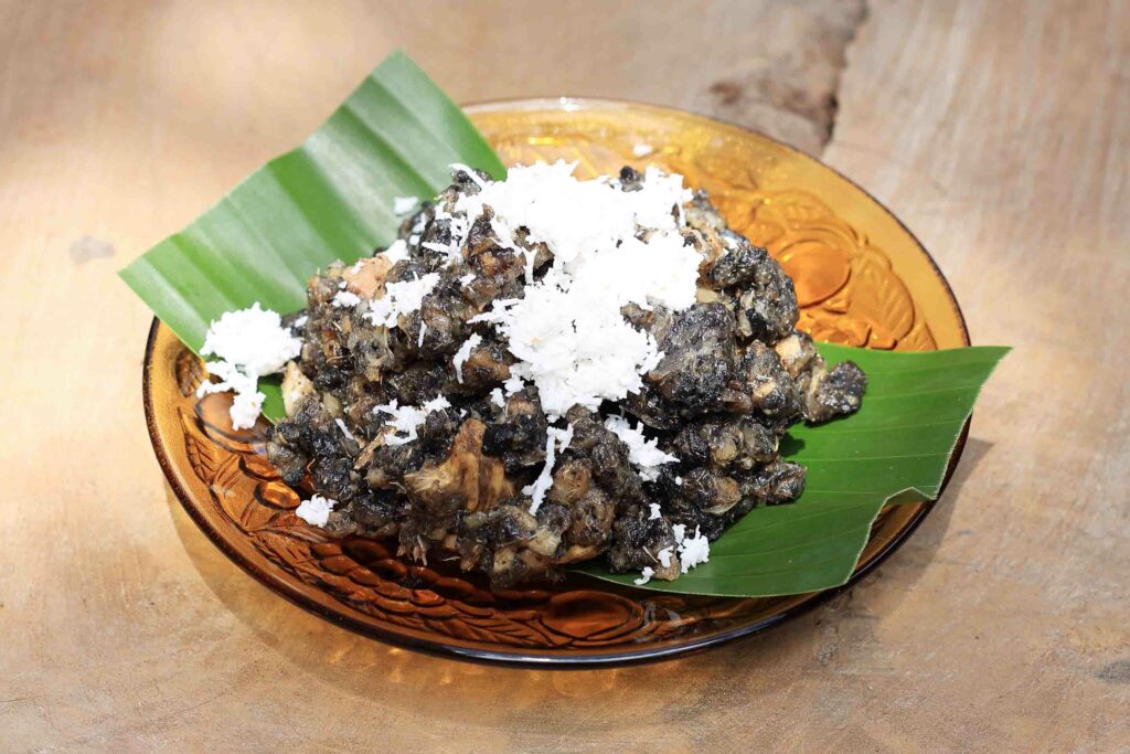 Gatot, Indonesian Traditional Food Made from Sun Dried Fermented Cassava, Topping with Grated Coconut. Steamed