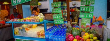 Malaysian fruit market vendor