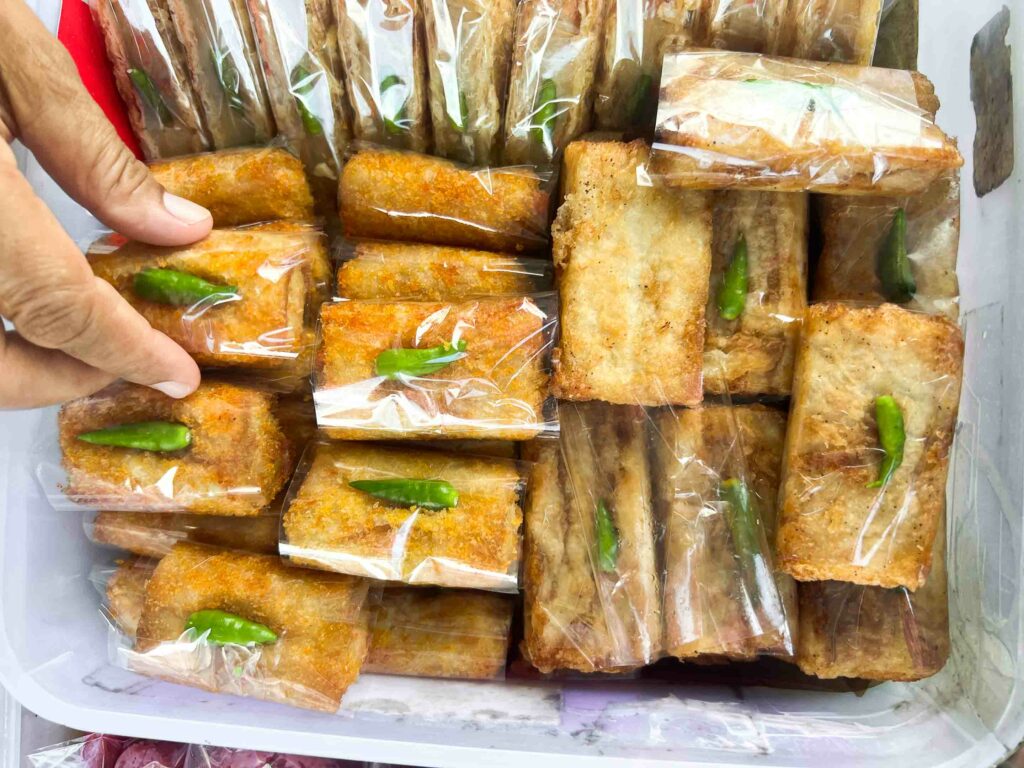 Risoles street food snack in plastic in a tupperware in Yogyakarta Indonesia