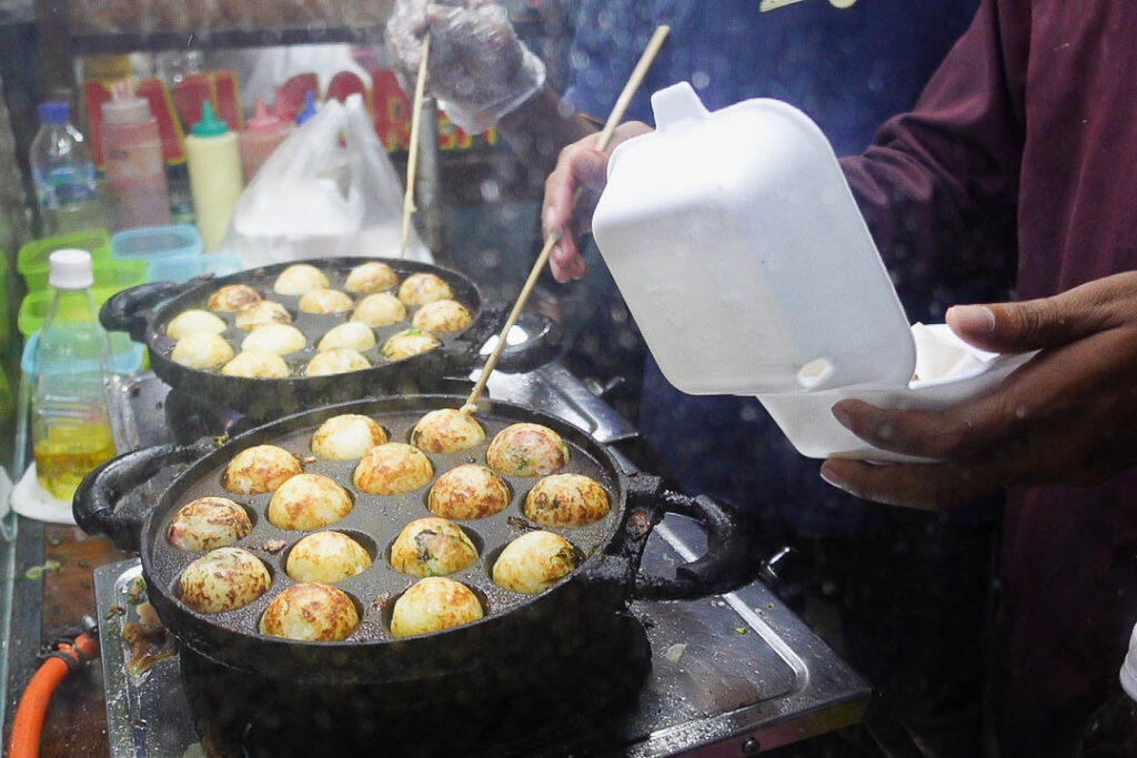 Takoyaki street food at a night market in Indonesia