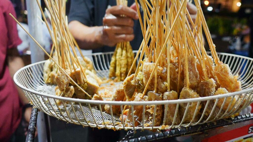 Telor guling a popular street food in Indonesia of whipped egg on a stick