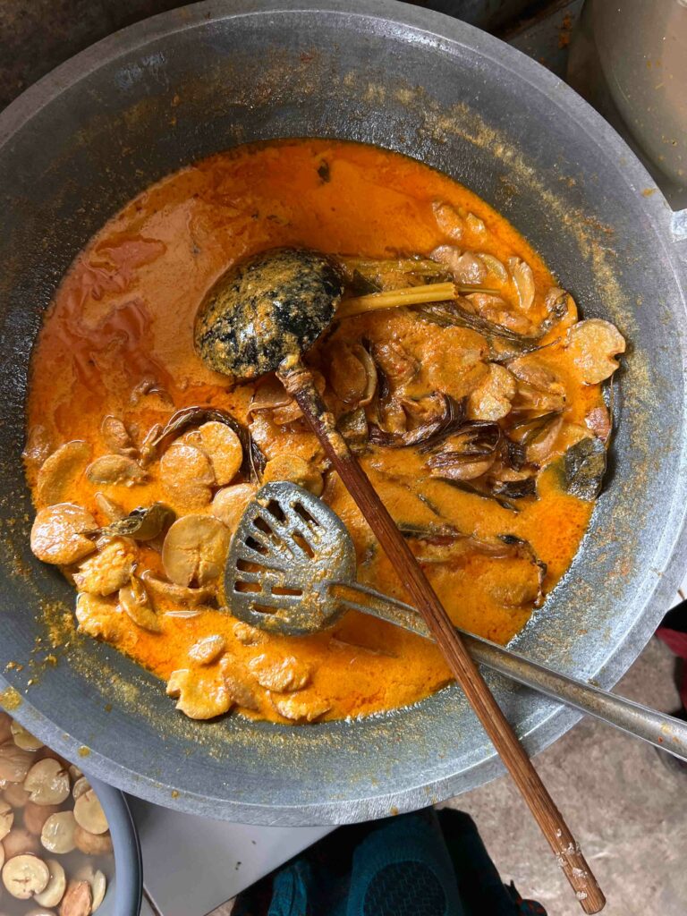 Gulai Jariang a jengkol curry cooking in a pot in Padang Indonesia