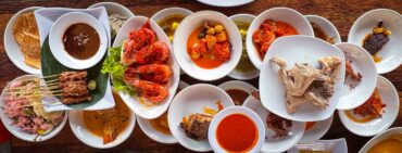 Masakan Padang restaurant with various plates on table