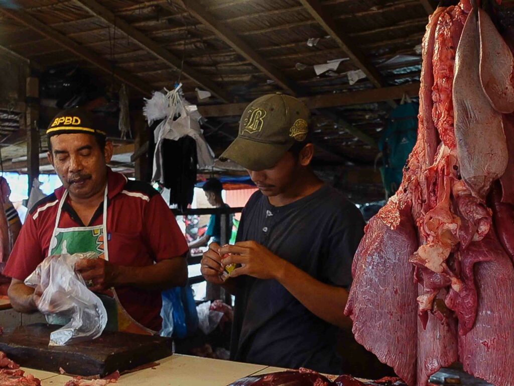 Padang market vendors selling beef