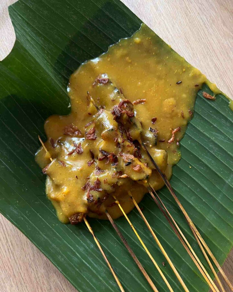 sate Padang a traditional satay in West Sumatra Indonesia on a banana leaf