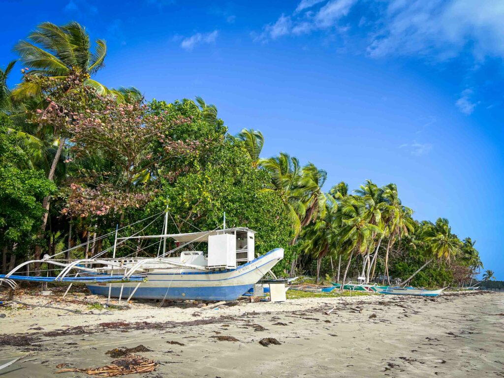 Fishing boat on beach in Sibaltan El Nido Palawan Philippines