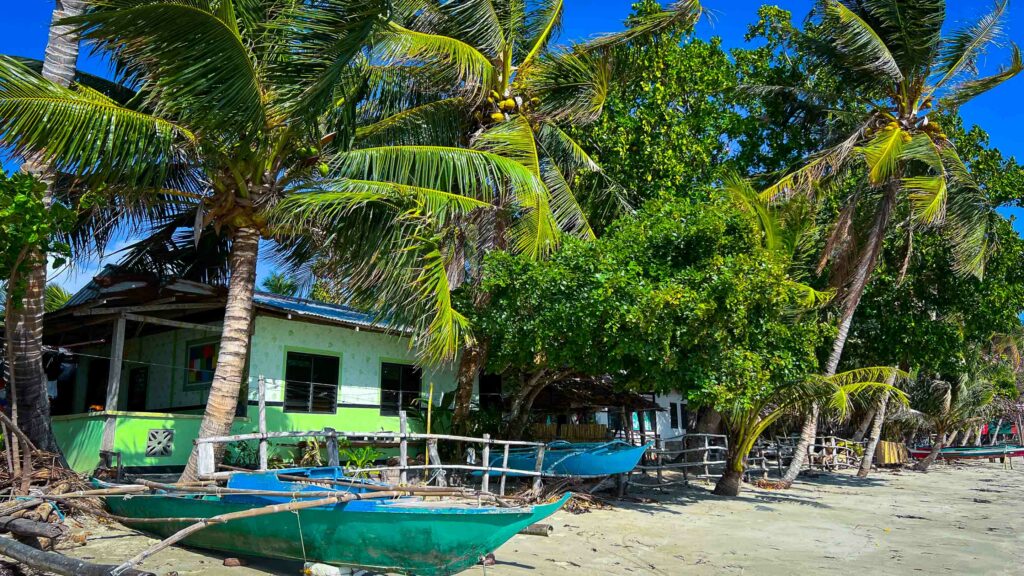 Sibaltan homes and boats view from beach